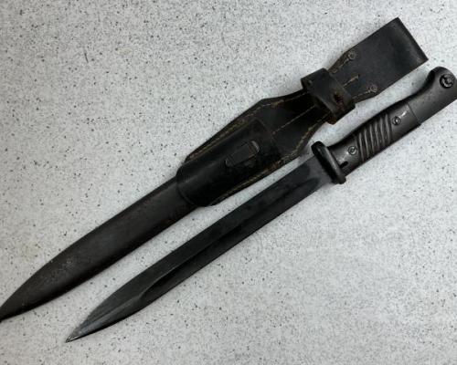 K98 combat bayonet by E.PACK 1939 dated and Bakelite grips. Leather frog and matching numbers. $325